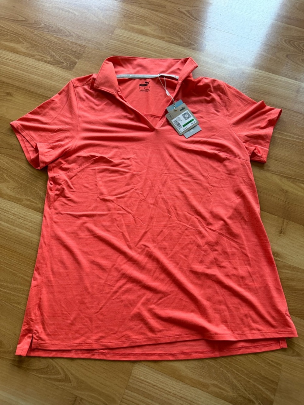 Puma NWT‎ women’s “Cloudspun Coast” polo in coral orange color size large